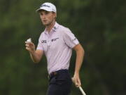 Will Zalatoris waves after making a putt on the eighth hole during the second round of the PGA Championship golf tournament at Southern Hills Country Club, Friday, May 20, 2022, in Tulsa, Okla.