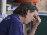 Seattle Mariners starting pitcher Logan Gilbert sits in the dugout after the top of the fourth inning of a baseball game after he gave up a grand slam to Philadelphia Phillies' Rhys Hoskins, Wednesday, May 11, 2022, in Seattle. (AP Photo/Ted S.