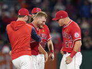 Los Angeles Angels starting pitcher Reid Detmers (48) celebrates with Mike Trout (27) after throwing a no hitter against the Tampa Bay Rays in a baseball game in Anaheim, Calif., Tuesday, May 10, 2022. The Angels won 12-0.