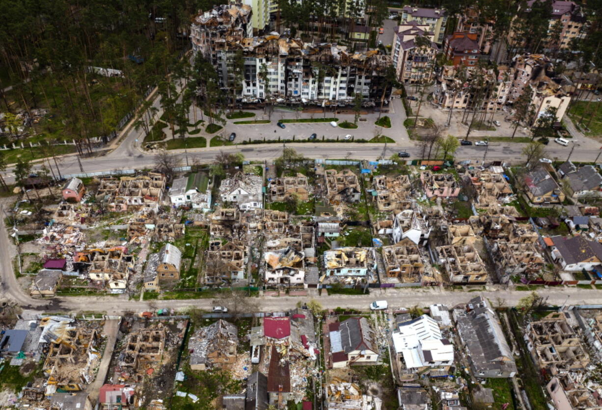 Destroyed houses are photographed in Irpin, on the outskirts of Kyiv, Ukraine, Saturday, April 30, 2022.