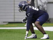 Seattle Seahawks offensive tackle Charles Cross gets set in a three-point stance during NFL football rookie minicamp Friday, May 6, 2022, in Renton, Wash. (AP Photo/Ted S.