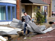 Tony Dowdy, of Victory Family Church, helps clean up tornado damage in Seminole, Okla. on Thursday, May, 5, 2022. A springtime storm system spawned several tornadoes that whipped through areas of Texas and Oklahoma, causing damage to a school, a marijuana farm and other structures.