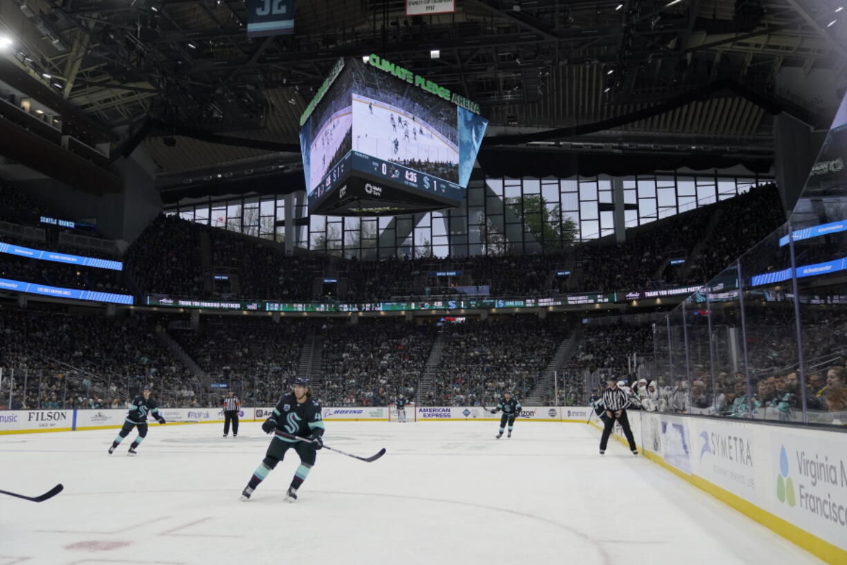 The Seattle Kraken and the San Jose Sharks play during the first period of an NHL hockey game Friday, April 29, 2022, at Climate Pledge Arena in Seattle. (AP Photo/Ted S.