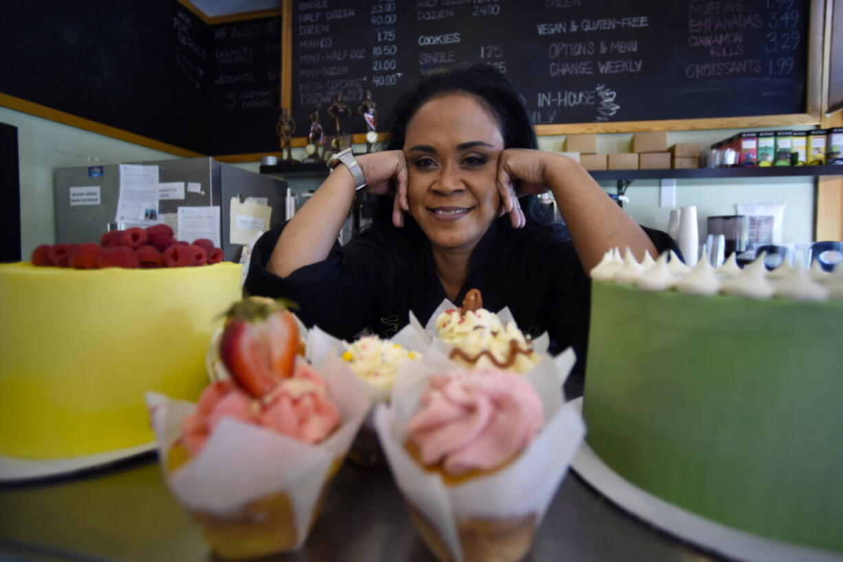 Shirley Hughes, owner of Sweet Cheats bakery, poses for a photo, Friday, April 15, 2022, in Atlanta.  Some small businesses are still struggling to hire qualified workers, even as the broader picture in the U.S. job market looks much brighter.