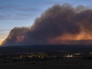 Smoke from the Calf Canyon/Hermits Peak Fire drifts over Las Vegas, N.M., on Saturday, May 7, 2022.