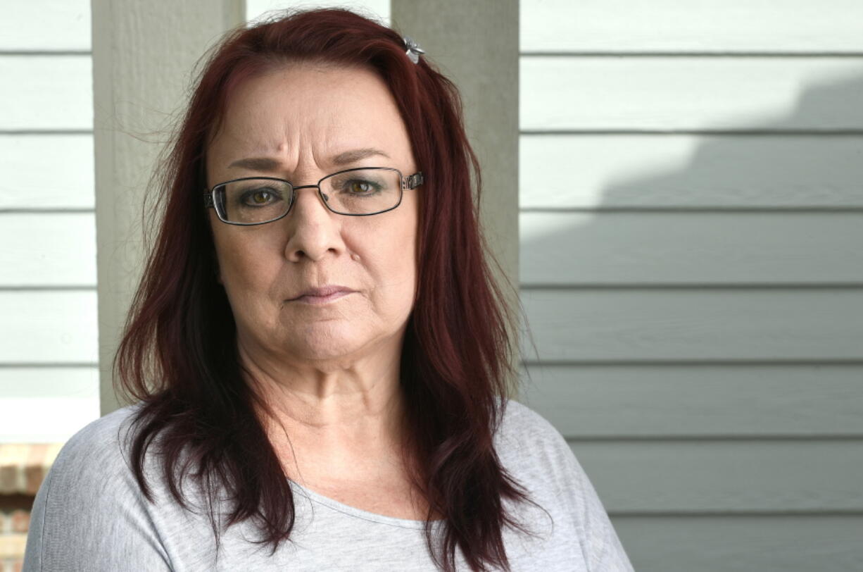 Back surgery patient Lisa French is photographed outside of her house on June 20, 2018 in Thornton, Colo.  Colorado's Supreme Court has ruled in favor of French who expected to pay about $1,300 for back surgery but was charged more than $300,000 by a suburban Denver hospital. This week's ruling follows efforts by many U.S. states and the federal government to require transparency in hospital pricing and eliminate so-called "surprise billing."  (Helen H.