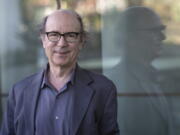 In this photo provided by the Templeton Prize, physicist Frank Wilczek stands for a portrait at Arizona State University in Tempe, Ariz., on March 17, 2022. Wilczek, the Nobel Prize-winning theoretical physicist and author renowned for his boundary-pushing investigations into the fundamental laws of nature, was honored Wednesday, May 11, 2022, with the Templeton Prize, awarded to individuals whose life's work embodies a fusion of science and spirituality.