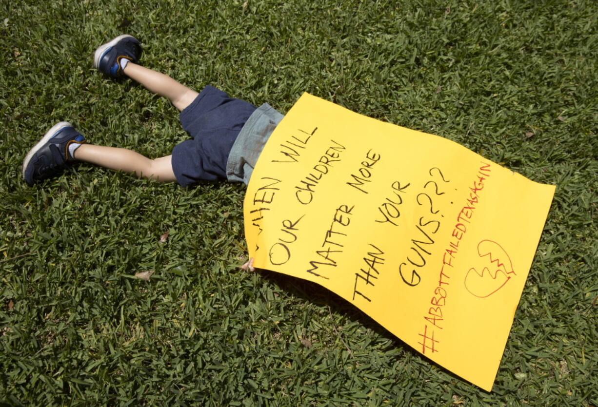 Remy Ragsdale, 3, attends a protest organized by Moms Demand Action on Wednesday May 25, 2022, at the Governor's Mansion in Austin, Texas, after a mass shooting at an elementary school in Uvalde.