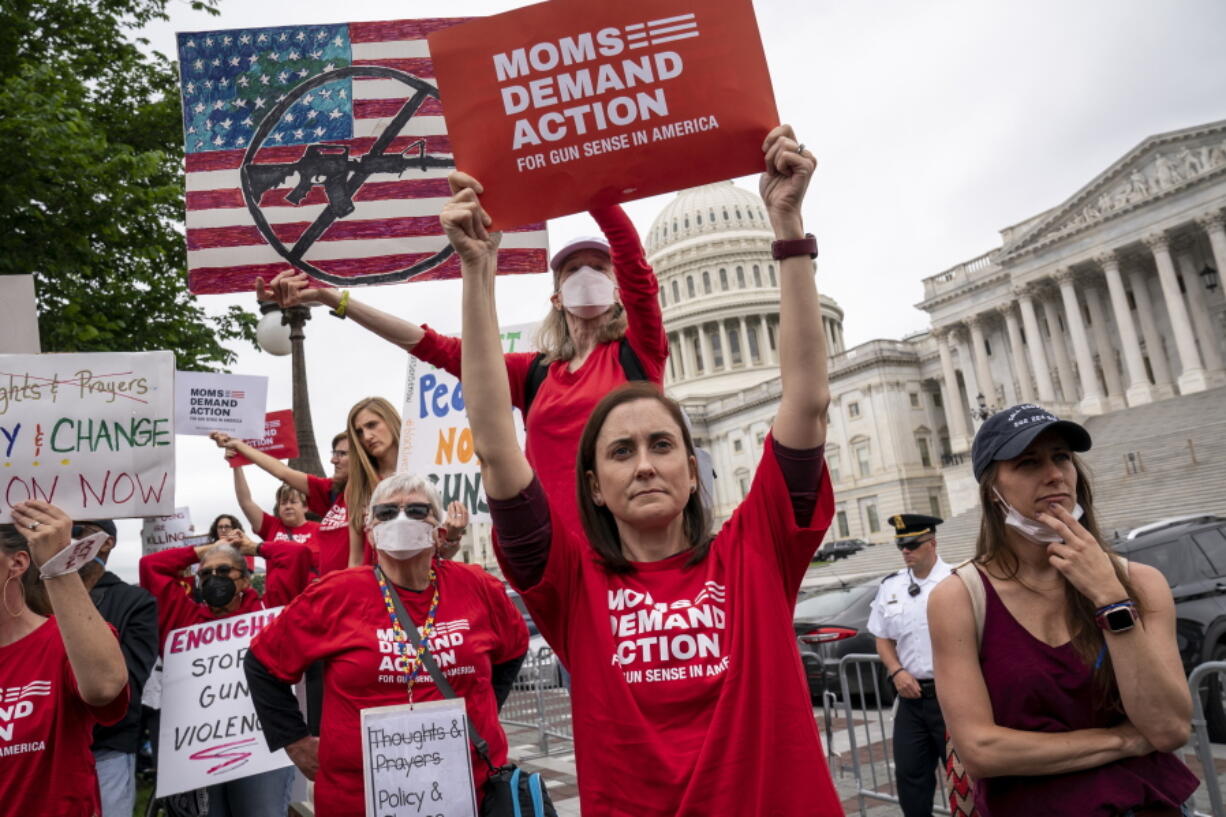 Activists join Senate Democrats outside the Capitol to demand action on gun control legislation after a gunman killed 19 children and two teachers in a Texas elementary school this week, in Washington, Thursday, May 26, 2022. A bipartisan group of senators is considering how Congress should respond to the horrific shooting of 19 children and two teachers in Uvalde, Texas. (AP Photo/J.