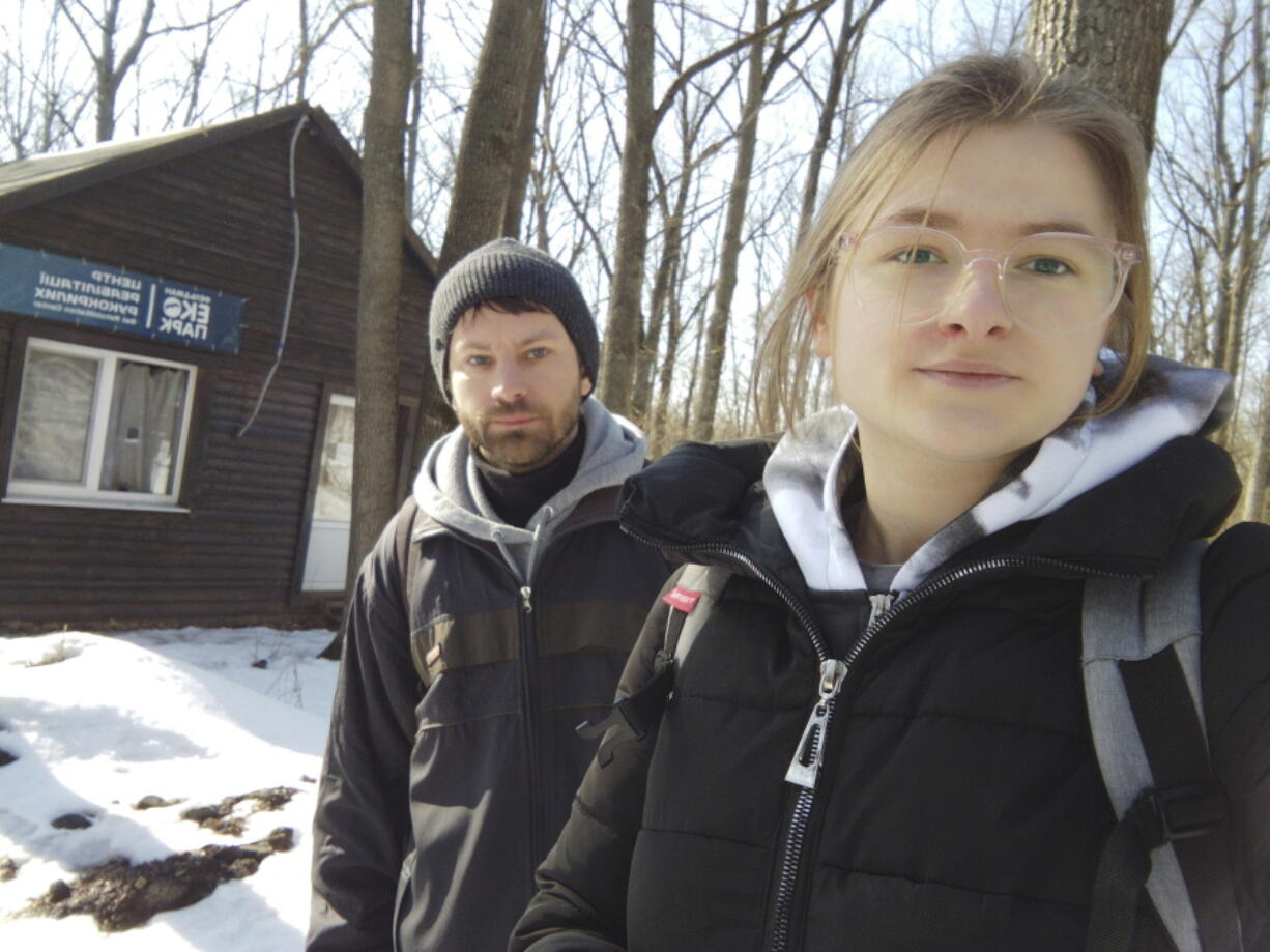 This March 2022 photo provided by Alona Shulenko shows her, right, and fellow zoologist Anton Vlaschenko outside the Feldman Ecopark area outpost of the Ukrainian Bat Rehabilitation Center in Kharkiv, Ukraine. "Our staying in Ukraine, our continuing to work - it's some kind of resistance of Russian invasion," Vlaschenko said via Zoom, a barrage of shelling audible in the background. "The people together in Ukraine are ready to fight, not only with guns.