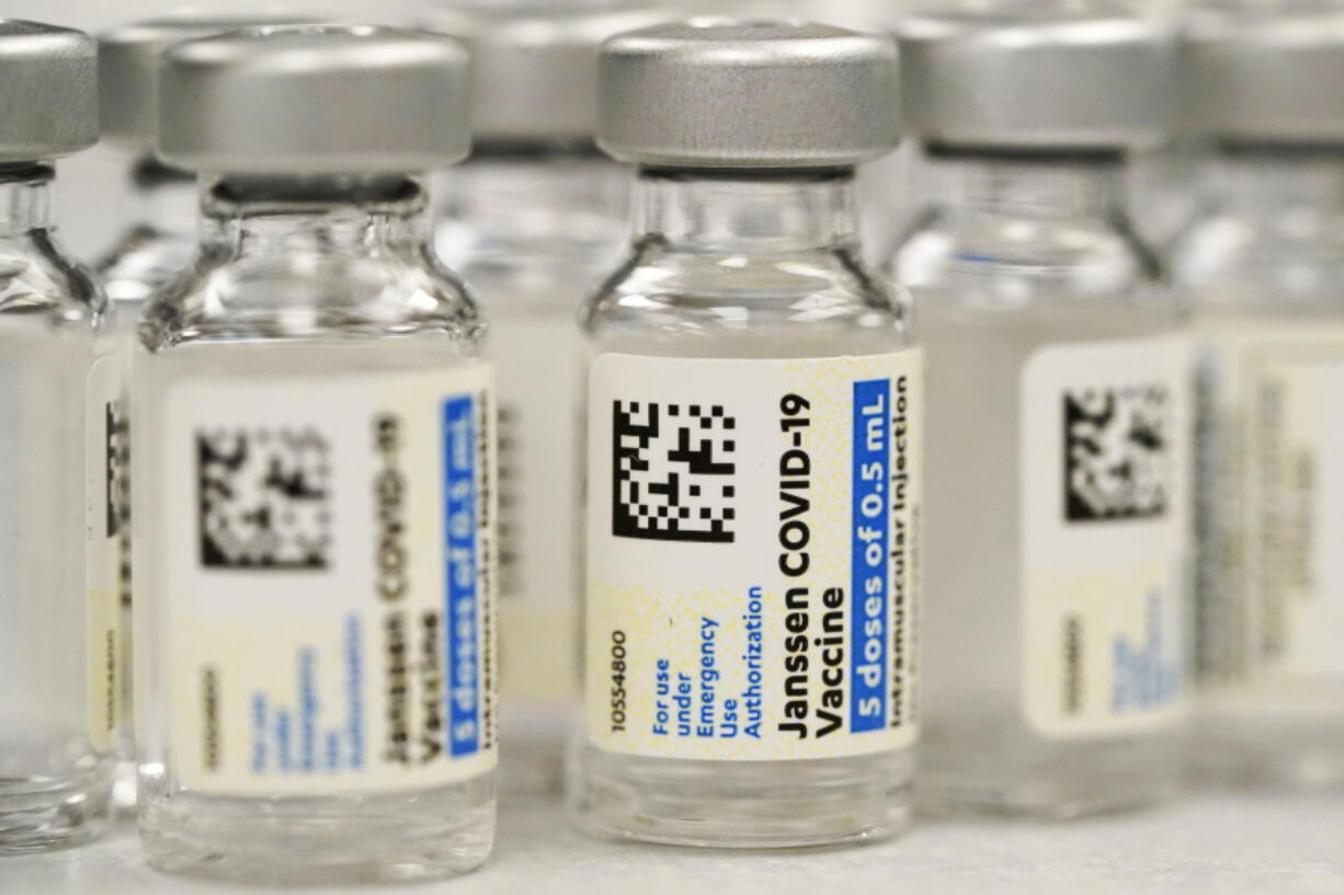 FILE - Vials of the Johnson & Johnson COVID-19 vaccine are seen at a pharmacy in Denver on Saturday, March 6, 2021. On Thursday, May 5, 2022, U.S. regulators strictly limited who can receive this vaccine due to a rare but serious risk of blood clots.