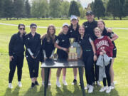 Woodland girls golf team poses with the 2A district trophy after their victory on Tuesday, May 17, 2022 at Mint Valley Golf Course in Longview.