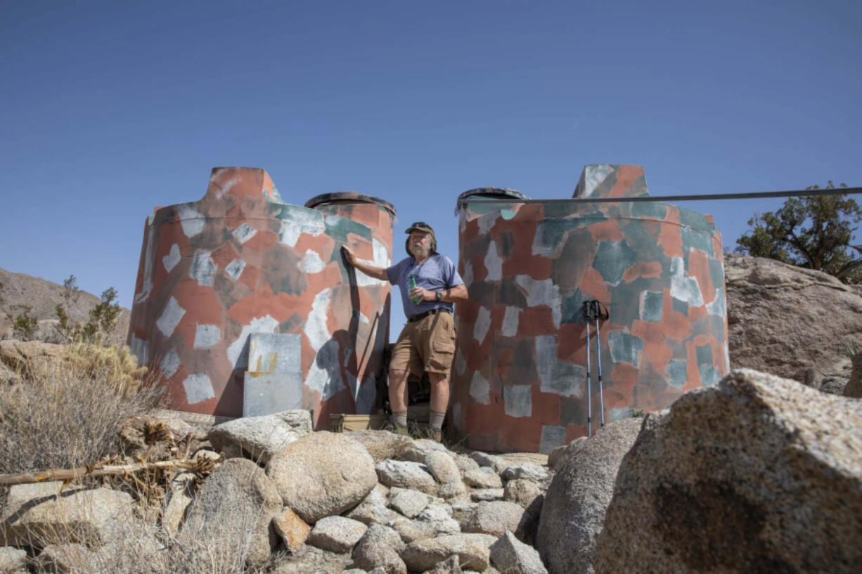 Former Anza-Borrego Desert State Park Superintendent Mark Jorgensen stands in front of a wildlife "guzzler" in the Vallecito Mountains off state Route 78 about 12 miles south of California's Borrego Springs. The system captures rainwater to feed wildlife such as bighorn sheep.