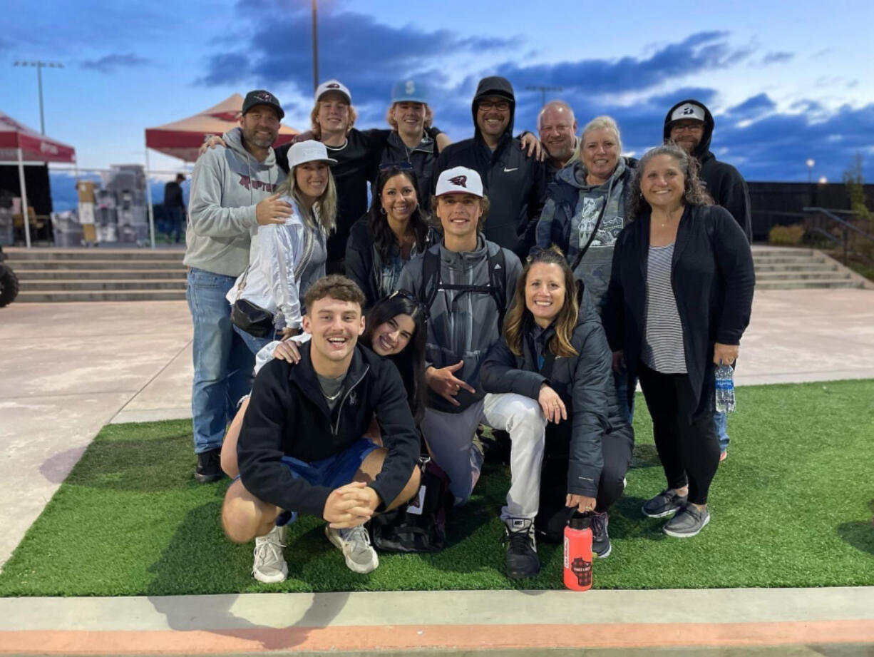 Eastyn Culp (middle) poses with friends and family on Wednesday, June 15, 2022, at the RORC, where he pitched his first home game with the Ridgefield Raptors.