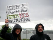 Photos by Dylan Jefferies/The Columbian 
Heritage High School English teacher Paul Hamonn speaks to a large crowd of demonstrators at a March for Our Lives rally at Vancouver Waterfront Park on Saturday.