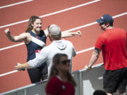 Kara Winger hugs her husband and coach Russ Winger after winning the women's javelin at the U.S. outdoor track and field championships on Saturday, June 25, 2022, in Eugene, Ore.