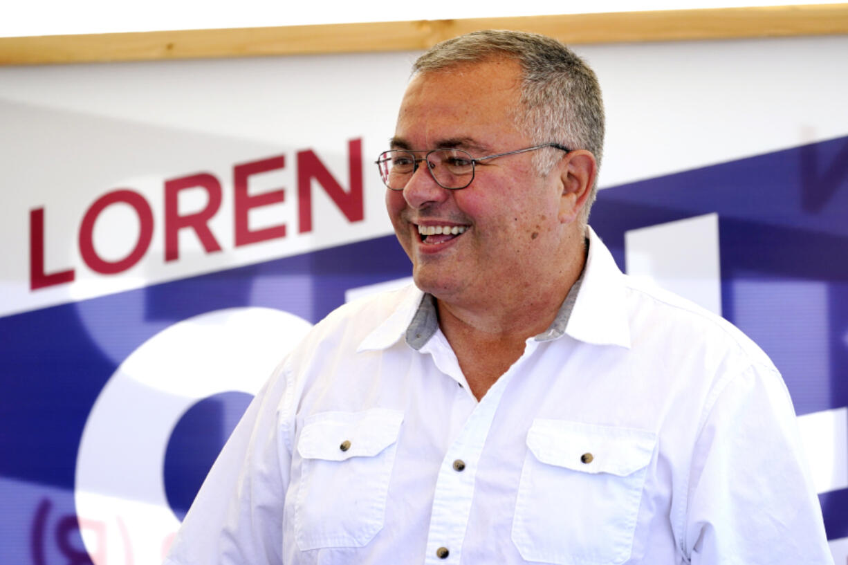 Republican gubernatorial candidate Loren Culp smiles while greeting supporters at a rally Saturday, Aug. 29, 2020, in Mount Vernon, Wash. Culp, police chief of the town of Republic, Wash., and author of the book "American Cop: Upholding the Constitution and Defending Your Right to Bear Arms," will face off against incumbent Democratic Gov. Jay Inslee in November.