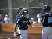 The Vancouver Mavericks' Zach Blair is greeted by Mitch Johnson after scoring in the Mavericks' 3-2 loss to the Portland Baseball Club in the opening game of the Curt Daniels Invitational on Wednesday, June 29, 2022 at Union High School (Tim Martinez/The Columbian)