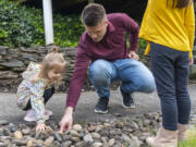 Sergey Kushnarenko, right, plays with his 2-year-old daughter, Ellen, at his home in Vancouver. Kushnarenko, his daughter and his then-pregnant wife, Sofia, fled Ukraine to escape the Russian invasion. Kushnarenko remembers seeing roughly 10 residential buildings bombed in his hometown of Zaporizhzhia, Ukraine, 450 miles east of Kyiv, shortly after the invasion began on Feb. 24. Two weeks later, the family fled Ukraine with nowhere to go.