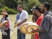 The Cowlitz Indian Tribe Drum Group performs a song Wednesday, June 1, 2022, before a groundbreaking ceremony at the future site of Clark CollegeÄôs Boschma Farms campus in Ridgefield.