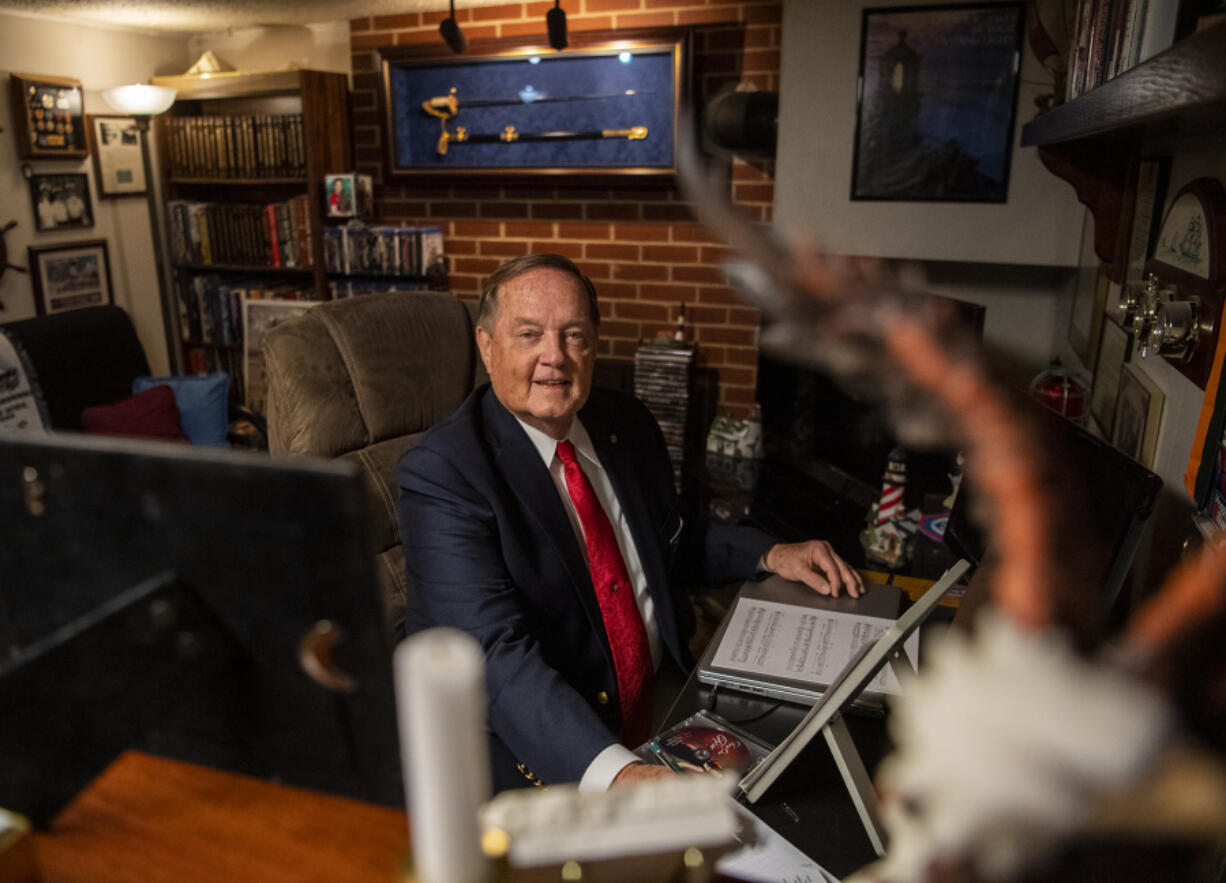 Ronald Carr sits at his desk at home in Vancouver where he composed "From One Rose," a theme song for the Portland Rose Festival performed by the Oregon Symphony May 26 as part of the Rose City Reunion Concert. Carr serves on the festival's board of directors.