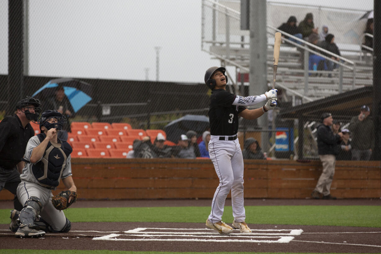 Ridgefield Raptors catcher Jacob Sharp watches a fly ball during their West Coast League season opener against the  Walla Walla Sweets at Ridgefield Outdoor Recreation Complex on Friday, June 3, 2022.