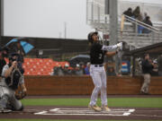 Ridgefield Raptors catcher Jacob Sharp watches a fly ball during their West Coast League season opener against the  Walla Walla Sweets at Ridgefield Outdoor Recreation Complex on Friday, June 3, 2022.