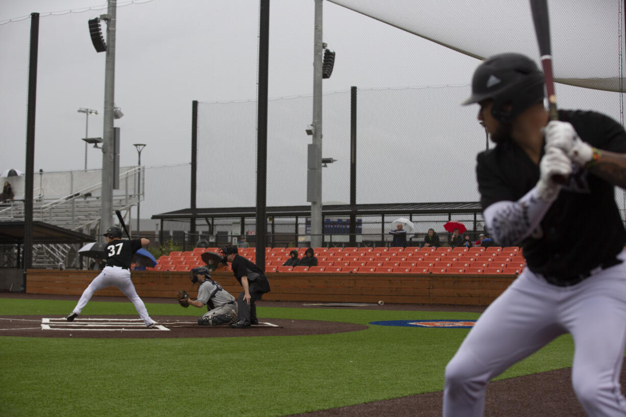 Raptor's Safea Mauai, right, takes a practice swing while Riley McCarthy is at bat during a game against the Walla Walla Sweets at Ridgefield Outdoor Recreation Complex on Friday, June 3, 2022.