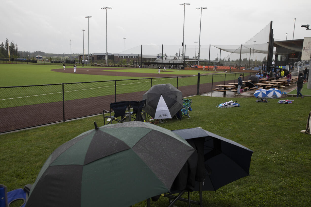 Fans brave the rain for the Ridgefield Raptors' West Coast League regular season opener on Friday, June 3, 2022,  at Ridgefield Outdoor Recreation Complex.