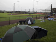 Fans brave the rain for the Ridgefield Raptors' West Coast League regular season opener on Friday, June 3, 2022,  at Ridgefield Outdoor Recreation Complex.