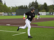 Mikey Kane of the Ridgefield Raptors rounds third base during their West Coast League season opener against the  Walla Walla Sweets at Ridgefield Outdoor Recreation Complex on Friday, June 3, 2022.