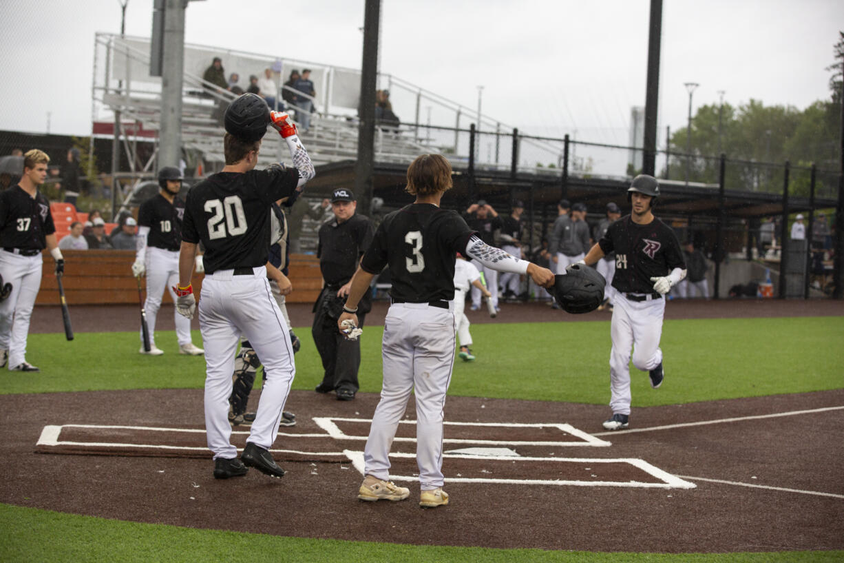 Ridgefield Raptors celebrate Will Chambers' home run against the Walla Walla Sweets 3at Ridgefield Outdoor Recreation Complex on Friday, June 3, 2022.