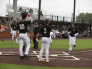 Ridgefield Raptors celebrate Will Chambers' home run against the Walla Walla Sweets 3at Ridgefield Outdoor Recreation Complex on Friday, June 3, 2022.