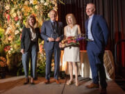 Executive vice president of the Community Foundation for Southwest Washington, Janie Spurgeon, left, and board Chair Randy Grove, right, stand with Ron Prill, center left, and Terry Prill.