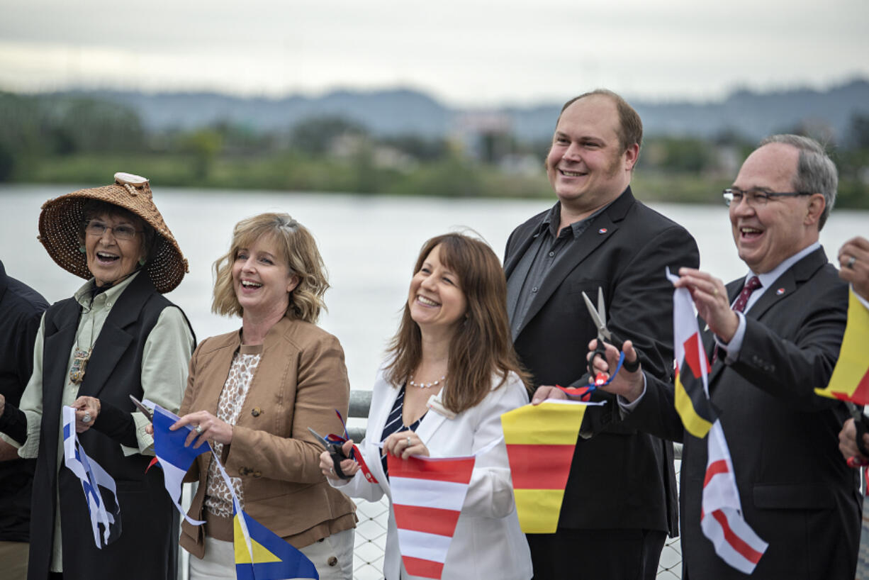 Tanna Engdahl, Cowlitz Tribe elder and spiritual leader, left, joins Sen. Annette Cleveland and Julianna Marler, Port of Vancouver CEO, as well as port Commissioners Eric LaBrant and Jack Burkman as they celebrate the ribbon-cutting of the Vancouver Landing on Thursday. The completed project kicks off the future  redevelopment of Terminal 1.