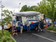 Donors who contributed to the FISH mobile food pantry unveil it for the first time. "We're embarking on a new adventure, and we're going to reach beyond the walls that we have here," Fish Executive Director James Fitzgerald said.