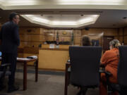 Clark County Prosecutor Tony Golik, left, speaks as Lani Kraabell, right, sits in the courtroom while pleading guilty to second-degree manslaughter June 10 in connection with sheriff's Sgt. Jeremy Brown's shooting.