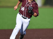 Raptors’ baserunner Jake Tsukada eyes third base Tuesday, June 14, 2022, during a Raptors game against the Edmonton Riverhawks at the Ridgefield Outdoor Recreation Complex.