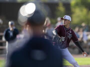 Raptors pitcher Brayden Marcum, right, throws the ball Tuesday, June 14, 2022, during a Raptors game against the Edmonton Riverhawks at the Ridgefield Outdoor Recreation Complex.