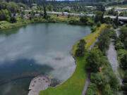 A swollen Salmon Creek flows through the Klineline Pond area as the Columbia River and surrounding areas continue to run high, as seen on Tuesday morning, June 14, 2022.