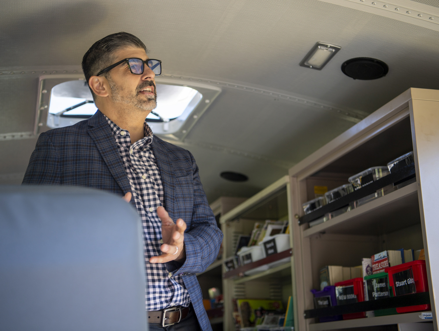 Camas School District Superintendent John Anzalone talks aboard the Book MoBus at Helen Baller Elementary School in 2022.