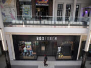 A shopper strolls past BoxLunch, one of two new tenants at Vancouver Mall. The mall is "more than back to normal" following the worst of the coronavirus pandemic, mall managers say.