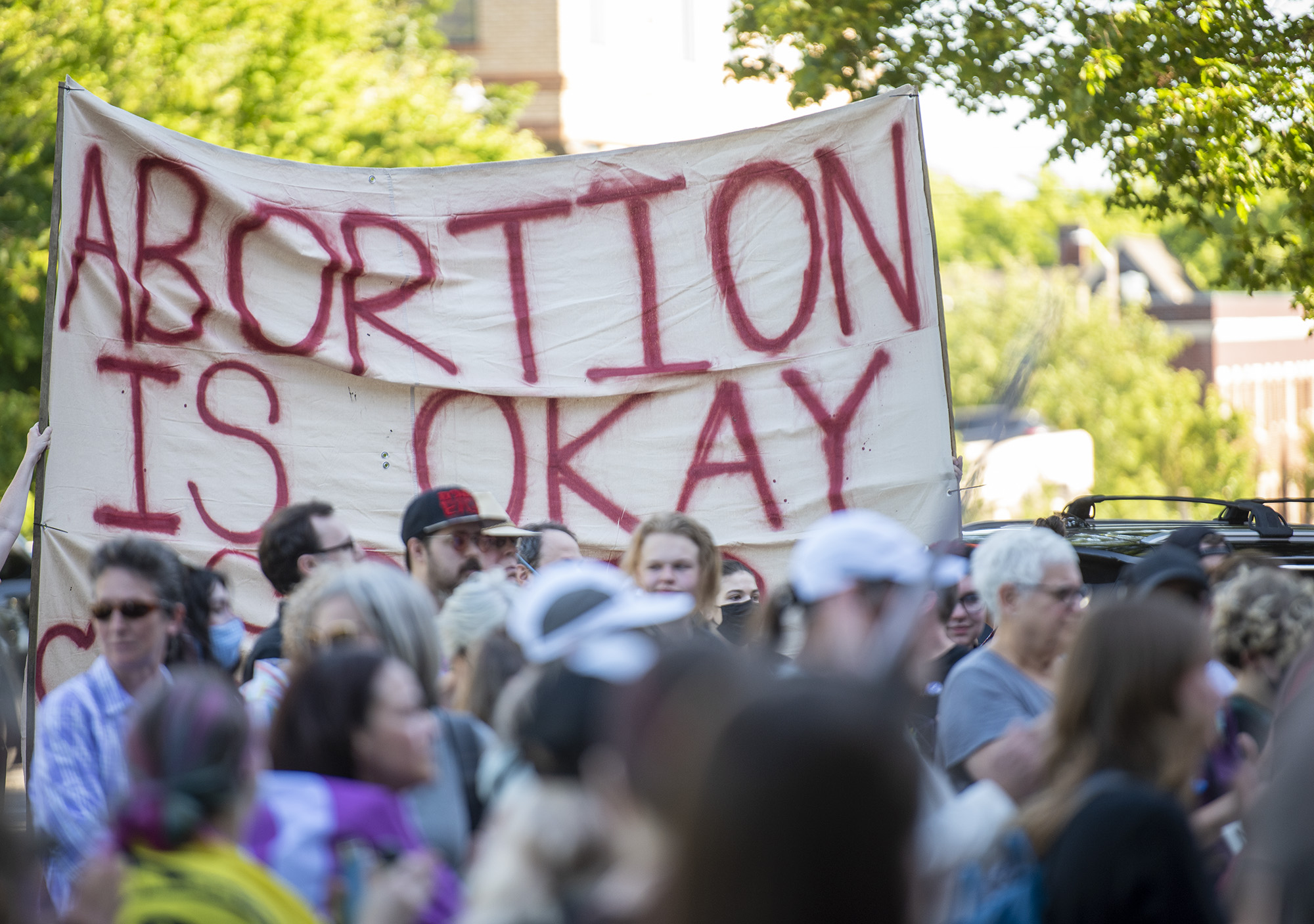 People hold up a large sign Friday, June 24, 2022, during a rally at the Clark County Courthouse in response to the Supreme Court’s decision to overturn the landmark Roe v. Wade that protected abortion access nationwide.