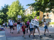 Protestors march around Esther Short Park on Friday, June 24, 2022, during a rally and march in response to the Supreme Court's decision to overturn the landmark Roe v. Wade that protected abortion access nationwide.