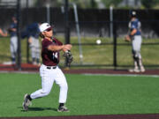 Raptors infielder Jake Tsukada throws the ball Tuesday, June 28, 2022, during a game between the Ridgefield Raptors and the Portland Pickles at the Ridgefield Outdoor Recreation Complex.