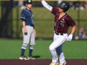 Raptors outfielder Jacob Sharp points as he rounds second base after a home run Tuesday, June 28, 2022, during a game between the Ridgefield Raptors and the Portland Pickles at the Ridgefield Outdoor Recreation Complex.