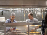 Volunteers Susan and Phil Harding serve eggs, waffles and sausages to participants in the Hot Meals program at the Share House on Tuesday morning. Before the COVID-19 pandemic, the program served roughly 3,000 meals a month. Now, it serves about 9,000 meals a month, and more volunteers are needed to keep up. "Share says all the time that they couldn't do it without volunteers," Phil Harding said.