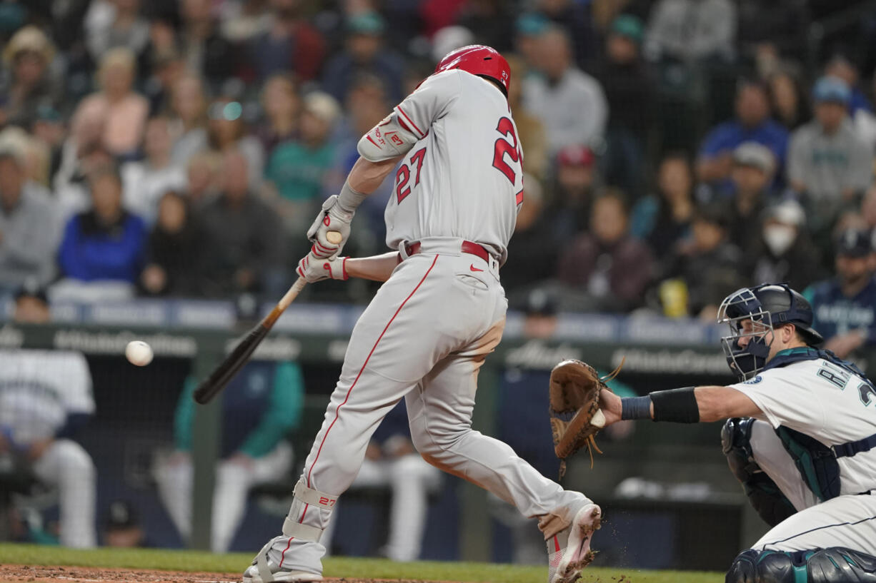 Los Angeles Angels' Mike Trout hits a two-run home run during the seventh inning of the team's baseball game against the Seattle Mariners, Thursday, June 16, 2022, in Seattle. The homer was Trout's second of the game. (AP Photo/Ted S.