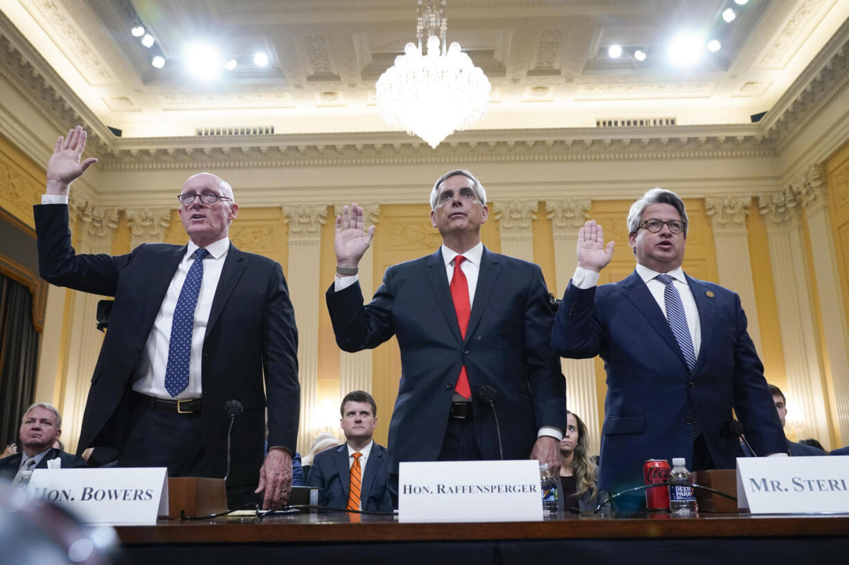 Rusty Bowers, Arizona state House Speaker, from left, Brad Raffensperger, Georgia Secretary of State, and Gabe Sterling, Georgia Deputy Secretary of State, are sworn in to testify as the House select committee investigating the Jan. 6 attack on the U.S. Capitol continues to reveal its findings of a year-long investigation, at the Capitol in Washington, Tuesday, June 21, 2022.