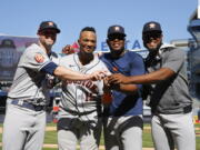 Houston Astros players, from left, relief pitcher Ryan Pressly, catcher Martin Maldonado, relief pitcher Hector Neris, and starting pitcher Cristian Javier celebrate after a combined no-hitter against the New York Yankees. Saturday, June 25, 2022, in New York. The Houston Astros won 3-0. (AP Photo/Noah K.